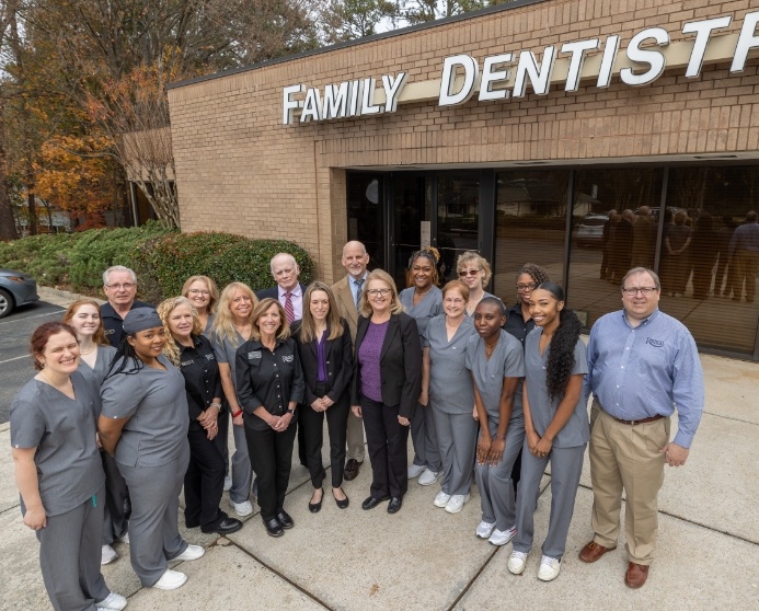 Rausch Family Dentistry team standing outside of Stone Mountain dental office building